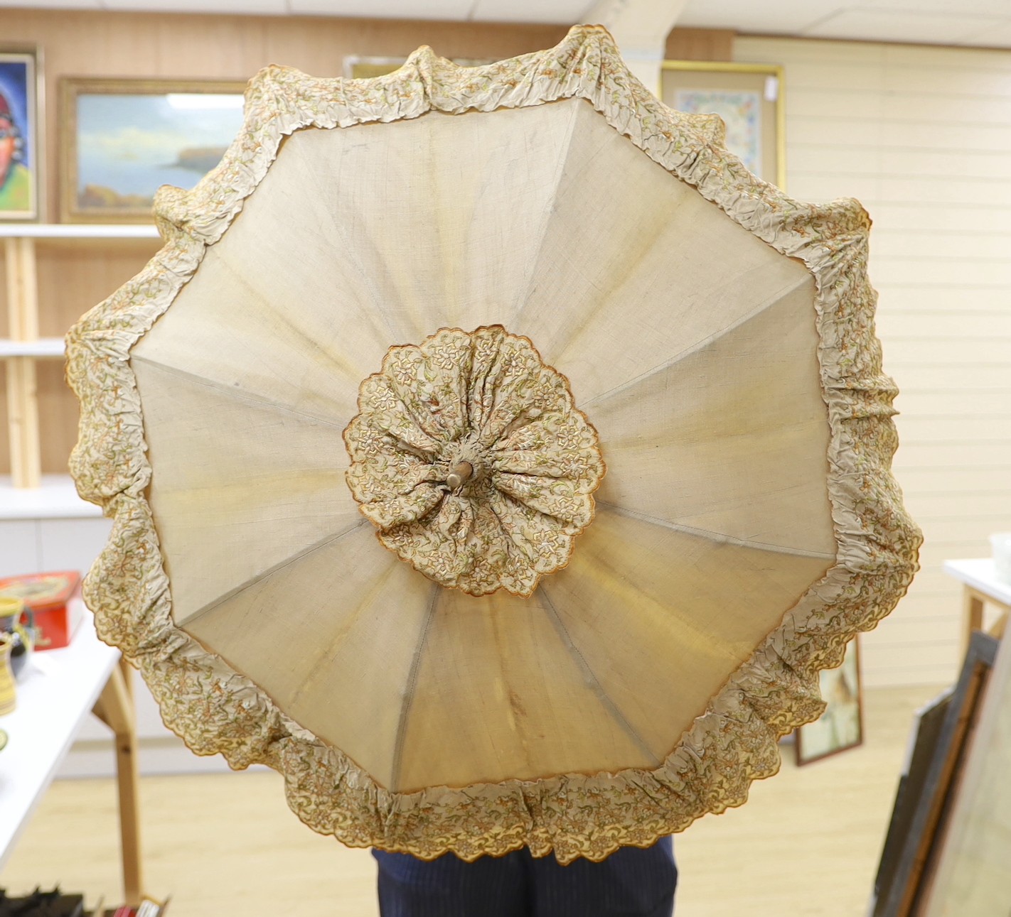An embroidered parasol with bamboo handle. 88.5cm high